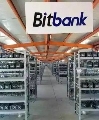 A large mining farm with rows of servers, highlighting the scale and complexity of the operation.