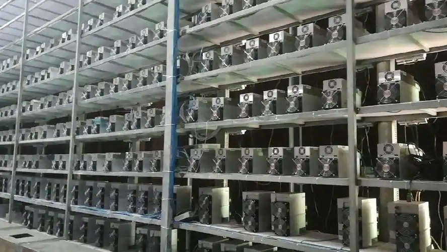 A modern mining farm showcasing rows of mining machines in an industrial setting
